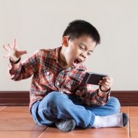 Young boy and smartphone