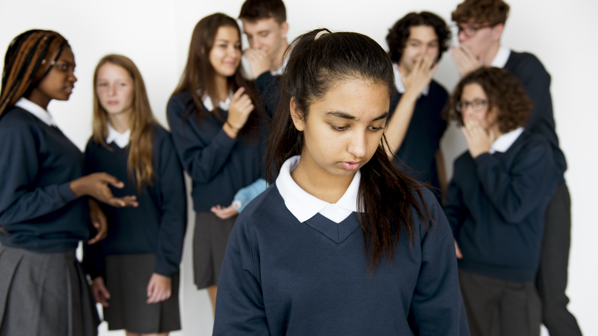 teen girl being bully in school corridor