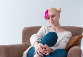 Pink Haired Blond Girl Wearing Cozy White Sweater And Jeans