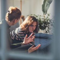 Teenage girl in difficult mood with angry mom.