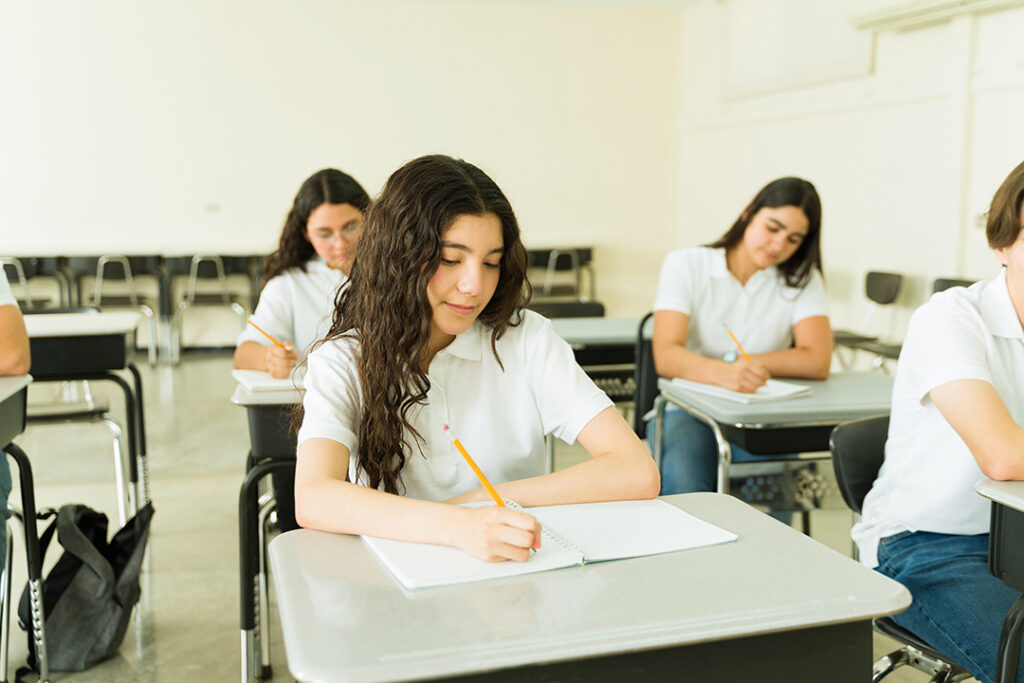 teenage school girls writing