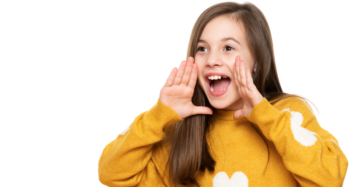 young teen cupping hands to mouth and shouting