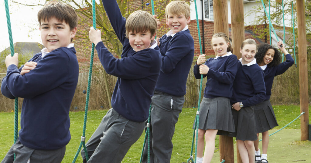 Portrait Of Elementary School Pupils On Climbing Equipment