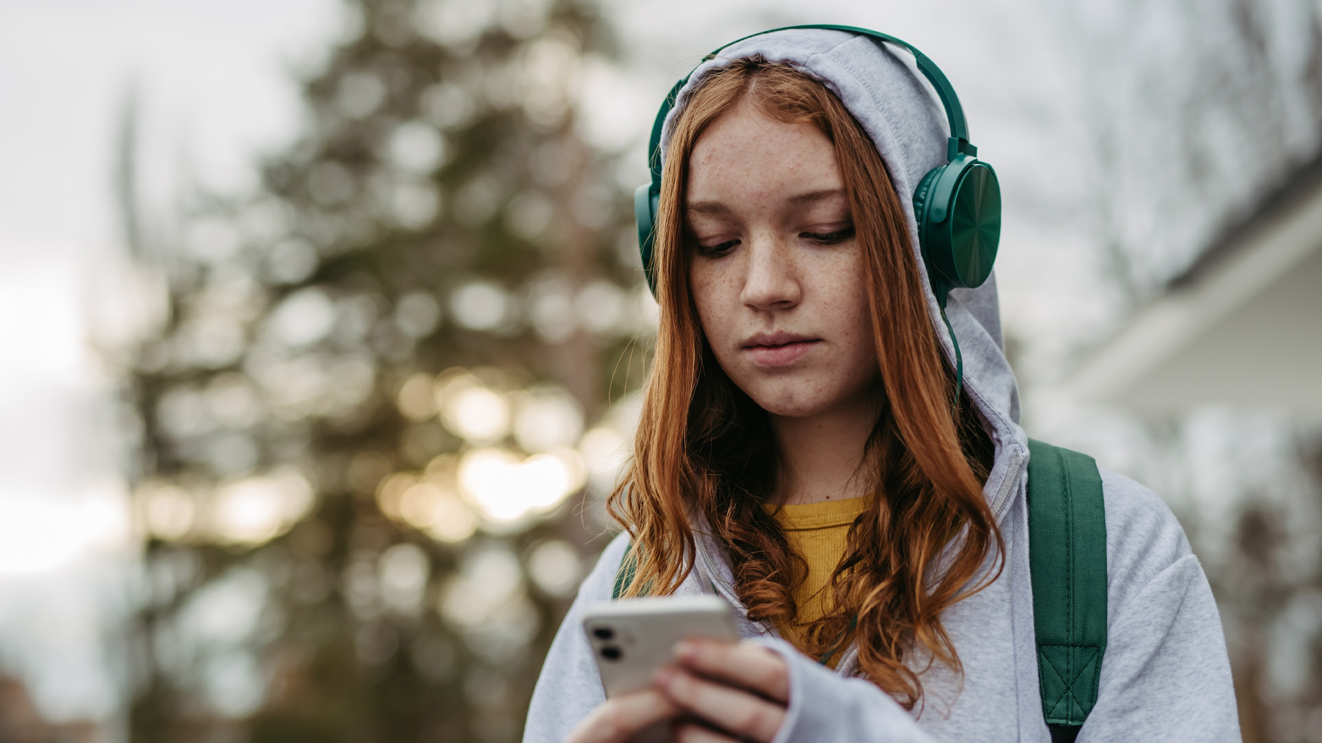 Portrait of teenage girl looking at her smartphone